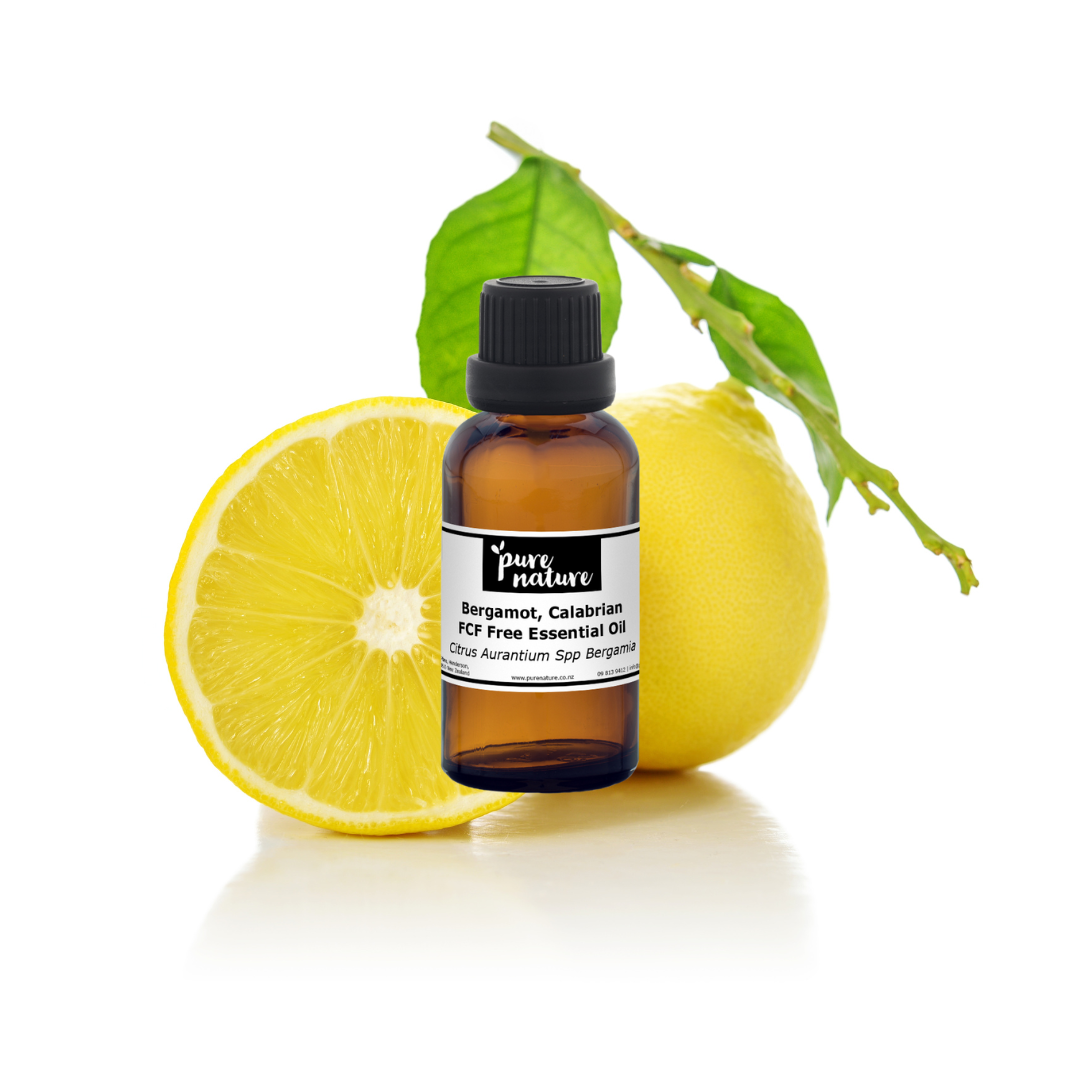 Bergamot Calabrian essential oil in a glass bottle, featuring fresh citrus fruit and green leaves on the label.