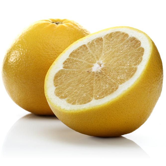 Purenaturenz white grapefruit essential oil bottle with fresh grapefruit slices and natural ingredients visible.