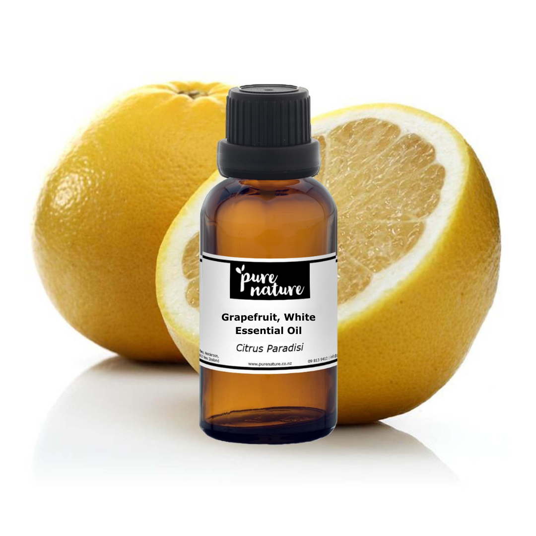 White grapefruit essential oil from purenaturenz in a glass dropper bottle with fresh grapefruit slices beside it