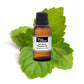 Bottle of purenaturenz Patchouli Essential Oil with a dark amber glass container and a white cap, placed on a neutral background.