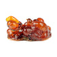 Purenaturenz Peru Balsam essential oil in a clear glass bottle with a black cap and a label displaying product details.