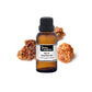 Bottle of purenaturenz Myrrh Essential Oil with label, displayed on a neutral background.