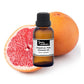 Pink grapefruit essential oil from purenaturenz in a glass bottle with a citrus fruit background, highlighting natural aromatic packaging.