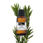 Botanical bottle of purenaturenz Niaouli essential oil with fresh leaves and aromatic aroma, showcasing natural essential oils.
