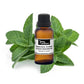 Organic peppermint arvensis essential oil in a glass bottle, showing fresh peppermint leaves and clear liquid.