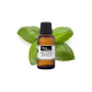 Organic basil essential oil from purenaturenz in a glass bottle with a green label, showcasing the aromatic herbal oil.