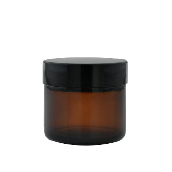 Amber 60ml glass pot for packaging by Purenaturenz, shown with a clear view of the compact, reusable container.